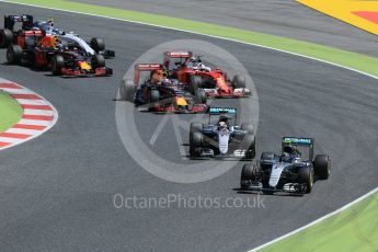 World © Octane Photographic Ltd. Mercedes AMG Petronas W07 Hybrid – Nico Rosberg and Lewis Hamilton lead into the 1st corner. Sunday 15th May 2016, F1 Spanish GP Race, Circuit de Barcelona Catalunya, Spain. Digital Ref :