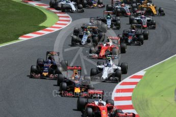 World © Octane Photographic Ltd. The pack heads through turns 1 and 2 on the 1st lap. Sunday 15th May 2016, F1 Spanish GP Race, Circuit de Barcelona Catalunya, Spain. Digital Ref :