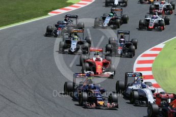 World © Octane Photographic Ltd. The pack heads through turns 1 and 2 on the 1st lap. Sunday 15th May 2016, F1 Spanish GP Race, Circuit de Barcelona Catalunya, Spain. Digital Ref :