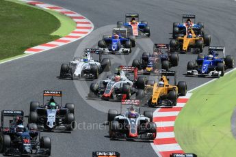 World © Octane Photographic Ltd. The pack heads through turns 1 and 2 on the 1st lap. Sunday 15th May 2016, F1 Spanish GP Race, Circuit de Barcelona Catalunya, Spain. Digital Ref :