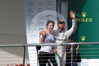 World © Octane Photographic Ltd. Mercedes AMG Petronas – Lewis Hamilton (1st) with Victoria Vowels - Mercedes Partner Services Director. Sunday 23rd October 2016, F1 USA Grand Prix Podium, Austin, Texas – Circuit of the Americas (COTA). Digital Ref :1750LB1D4222