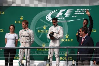 World © Octane Photographic Ltd. Mercedes AMG Petronas – Lewis Hamilton (1st) and Nico Rosberg (2nd) and Red Bull Racing – Daniel Ricciardo (3rd) with Victoria Vowels - Mercedes Partner Services Director. Sunday 23rd October 2016, F1 USA Grand Prix Podium, Austin, Texas – Circuit of the Americas (COTA). Digital Ref :1750LB1D4310