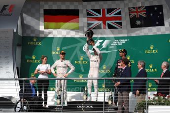 World © Octane Photographic Ltd. Mercedes AMG Petronas – Lewis Hamilton (1st) and Nico Rosberg (2nd) and Red Bull Racing – Daniel Ricciardo (3rd) with Victoria Vowels - Mercedes Partner Services Director. Sunday 23rd October 2016, F1 USA Grand Prix Podium, Austin, Texas – Circuit of the Americas (COTA). Digital Ref :1750LB1D4330