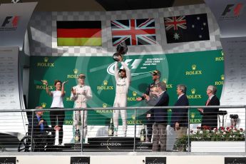 World © Octane Photographic Ltd. Mercedes AMG Petronas – Lewis Hamilton (1st) and Nico Rosberg (2nd) and Red Bull Racing – Daniel Ricciardo (3rd) with Victoria Vowels - Mercedes Partner Services Director. Sunday 23rd October 2016, F1 USA Grand Prix Podium, Austin, Texas – Circuit of the Americas (COTA). Digital Ref :1750LB1D4334