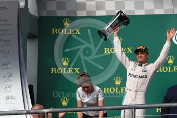 World © Octane Photographic Ltd. Mercedes AMG Petronas – Nico Rosberg (2nd) with Victoria Vowels - Mercedes Partner Services Director. Sunday 23rd October 2016, F1 USA Grand Prix Podium, Austin, Texas – Circuit of the Americas (COTA). Digital Ref :1750LB1D4373