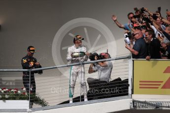 World © Octane Photographic Ltd. Fans with Mercedes AMG Petronas – Lewis Hamilton (1st) and Red Bull Racing – Daniel Ricciardo (3rd). Sunday 23rd October 2016, F1 USA Grand Prix Podium, Austin, Texas – Circuit of the Americas (COTA). Digital Ref :1750LB1D4472