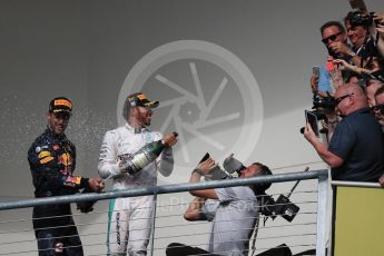 World © Octane Photographic Ltd. Fans with Mercedes AMG Petronas – Lewis Hamilton (1st) and Red Bull Racing – Daniel Ricciardo (3rd). Sunday 23rd October 2016, F1 USA Grand Prix Podium, Austin, Texas – Circuit of the Americas (COTA). Digital Ref :1750LB1D4481
