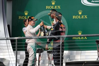 World © Octane Photographic Ltd. Mercedes AMG Petronas – Lewis Hamilton (1st) and Nico Rosberg (2nd) and Red Bull Racing – Daniel Ricciardo (3rd) with Victoria Vowels - Mercedes Partner Services Director. Sunday 23rd October 2016, F1 USA Grand Prix Podium, Austin, Texas – Circuit of the Americas (COTA). Digital Ref :1750LB1D4524