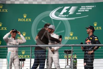 World © Octane Photographic Ltd. Gerard Butler with Mercedes AMG Petronas – Lewis Hamilton (1st) and Nico Rosberg (2nd) and Red Bull Racing – Daniel Ricciardo (3rd). Sunday 23rd October 2016, F1 USA Grand Prix Podium, Austin, Texas – Circuit of the Americas (COTA). Digital Ref :1750LB1D4619