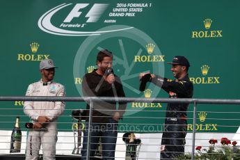 World © Octane Photographic Ltd. Gerard Butler with Mercedes AMG Petronas – Lewis Hamilton (1st) and Red Bull Racing – Daniel Ricciardo (3rd). Sunday 23rd October 2016, F1 USA Grand Prix Podium, Austin, Texas – Circuit of the Americas (COTA). Digital Ref :1750LB1D4683