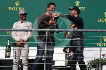World © Octane Photographic Ltd. Gerard Butler with Mercedes AMG Petronas – Lewis Hamilton (1st) and Red Bull Racing – Daniel Ricciardo (3rd). Sunday 23rd October 2016, F1 USA Grand Prix Podium, Austin, Texas – Circuit of the Americas (COTA). Digital Ref :1750LB1D4692