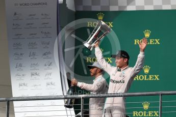World © Octane Photographic Ltd. Mercedes AMG Petronas – Lewis Hamilton (1st) and Nico Rosberg (2nd). Sunday 23rd October 2016, F1 USA Grand Prix Podium, Austin, Texas – Circuit of the Americas (COTA). Digital Ref :1750LB1D4778