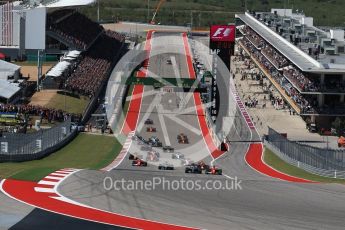 World © Octane Photographic Ltd. Formula 1 - American Grand Prix - Sunday - Race. Lewis Hamilton - Mercedes AMG Petronas F1 W08 EQ Energy+ starts on pole but Sebastian Vettel - Scuderia Ferrari SF70H makes a good move into Turn 1. Circuit of the Americas, Austin, Texas, USA. Sunday 22nd October 2017. Digital Ref: 1994LB2D7214