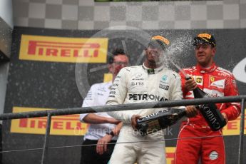 World © Octane Photographic Ltd. Formula 1 - Belgian Grand Prix - Podium. Lewis Hamilton (1st) - Mercedes AMG Petronas F1 W08 EQ Energy+ and Sebastian Vettel (2nd) - Scuderia Ferrari SF70H. Circuit de Spa Francorchamps, Belgium. Sunday 27th August 2017. Digital Ref:1934LB1D9470