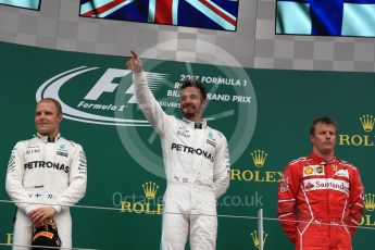 World © Octane Photographic Ltd. Formula 1 - British Grand Prix - Sunday - Race Podium. Lewis Hamilton and Valtteri Bottas - Mercedes AMG Petronas F1 W08 EQ Energy+ and Kimi Raikkonen - Scuderia Ferrari SF70H. Silverstone, UK. Sunday 16th July 2017. Digital Ref: 1893LB1D4762