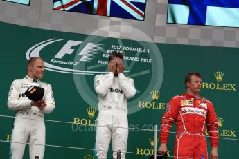 World © Octane Photographic Ltd. Formula 1 - British Grand Prix - Sunday - Race Podium. Lewis Hamilton and Valtteri Bottas - Mercedes AMG Petronas F1 W08 EQ Energy+ and Kimi Raikkonen - Scuderia Ferrari SF70H. Silverstone, UK. Sunday 16th July 2017. Digital Ref: 1893LB1D4772