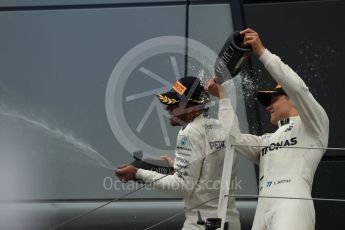 World © Octane Photographic Ltd. Formula 1 - British Grand Prix - Sunday - Race Podium. Lewis Hamilton and Valtteri Bottas - Mercedes AMG Petronas F1 W08 EQ Energy+ and Kimi Raikkonen - Scuderia Ferrari SF70H. Silverstone, UK. Sunday 16th July 2017. Digital Ref: 1893LB1D5020