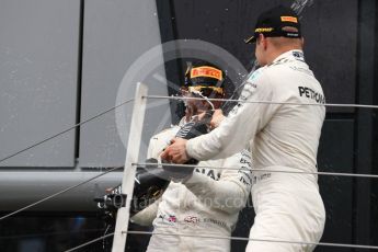 World © Octane Photographic Ltd. Formula 1 - British Grand Prix - Sunday - Race Podium. Lewis Hamilton and Valtteri Bottas - Mercedes AMG Petronas F1 W08 EQ Energy+ and Kimi Raikkonen - Scuderia Ferrari SF70H. Silverstone, UK. Sunday 16th July 2017. Digital Ref: 1893LB1D5053