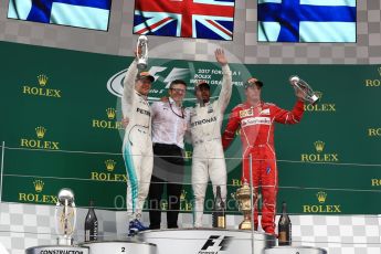 World © Octane Photographic Ltd. Formula 1 - British Grand Prix - Sunday - Race Podium. Lewis Hamilton and Valtteri Bottas - Mercedes AMG Petronas F1 W08 EQ Energy+ and Kimi Raikkonen - Scuderia Ferrari SF70H. Silverstone, UK. Sunday 16th July 2017. Digital Ref: 1893LB1D5131