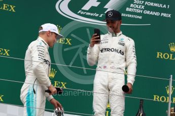 World © Octane Photographic Ltd. Formula 1 - British Grand Prix - Sunday - Race Podium. Lewis Hamilton and Valtteri Bottas Mercedes AMG Petronas F1 W08 EQ Energy+. Silverstone, UK. Sunday 16th July 2017. Digital Ref: 1893LB1D5274