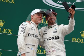 World © Octane Photographic Ltd. Formula 1 - British Grand Prix - Sunday - Race Podium. Lewis Hamilton and Valtteri Bottas Mercedes AMG Petronas F1 W08 EQ Energy+. Silverstone, UK. Sunday 16th July 2017. Digital Ref: 1893LB1D5306