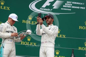 World © Octane Photographic Ltd. Formula 1 - British Grand Prix - Sunday - Race Podium. Lewis Hamilton and Valtteri Bottas Mercedes AMG Petronas F1 W08 EQ Energy+. Silverstone, UK. Sunday 16th July 2017. Digital Ref: 1893LB1D5319