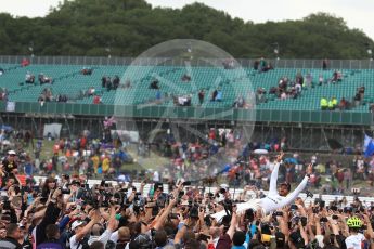 World © Octane Photographic Ltd. Formula 1 - British Grand Prix - Sunday - Race Podium. Lewis Hamilton - Mercedes AMG Petronas F1 W08 EQ Energy+ crowd surfs. Silverstone, UK. Sunday 16th July 2017. Digital Ref: 1893LB1D5506