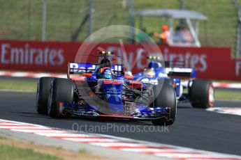 World © Octane Photographic Ltd. Formula 1 - Hungarian Grand Prix Practice 1. Carlos Sainz - Scuderia Toro Rosso STR12 and Pascal Wehrlein – Sauber F1 Team C36. Hungaroring, Budapest, Hungary. Friday 28th July 2017. Digital Ref: