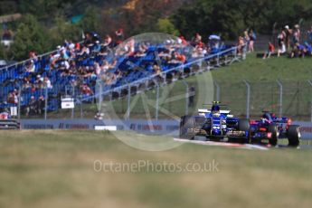 World © Octane Photographic Ltd. Formula 1 - Hungarian Grand Prix Practice 1. Pascal Wehrlein – Sauber F1 Team C36 and Daniil Kvyat - Scuderia Toro Rosso STR12. Hungaroring, Budapest, Hungary. Friday 28th July 2017. Digital Ref:1899LB1D7095