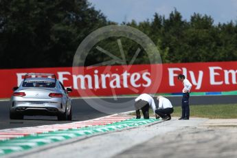 World © Octane Photographic Ltd. Formula 1 - Hungarian Grand Prix Practice 2. Laurent Mekies FIA safety director and Charlie Whiting FIA Formula One Race Director inspect the new Turn 4 kurbs. Hungaroring, Budapest, Hungary. Friday 28th July 2017. Digital Ref:1901LB1D7607