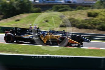 World © Octane Photographic Ltd. Formula 1 - Hungarian Grand Prix Practice 3. Jolyon Palmer - Renault Sport F1 Team R.S.17 and Kevin Magnussen - Haas F1 Team VF-17. Hungaroring, Budapest, Hungary. Saturday 29th July 2017. Digital Ref:1908CB2D1831