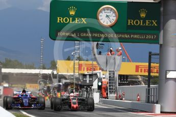 World © Octane Photographic Ltd. Formula 1 - Spanish Grand Prix Race. Carlos Sainz - Scuderia Toro Rosso STR12 and Kevin Magnussen - Haas F1 Team VF-17 go wheel to wheel out of the pits. Circuit de Barcelona - Catalunya, Spain. Sunday 14th May 2017. Digital Ref:1825LB1D4343