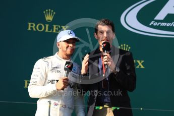 World © Octane Photographic Ltd. Formula 1 - Australian Grand Prix - Podium. Lewis Hamilton - Mercedes AMG Petronas F1 W08 EQ Energy+ and Mark Webber. Albert Park Circuit. Sunday 26th March 2017. Digital Ref: 1803LB1D7971