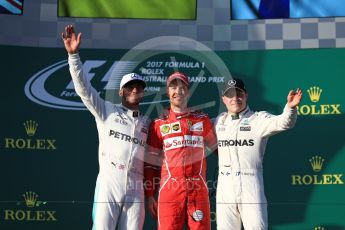 World © Octane Photographic Ltd. Formula 1 - Australian Grand Prix - Podium. Sebastian Vettel - Scuderia Ferrari SF70H, Lewis Hamilton and Valtteri Bottas - Mercedes AMG Petronas F1 W08 EQ Energy+. Albert Park Circuit. Sunday 26th March 2017. Digital Ref: 1803LB1D8100