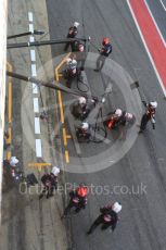 World © Octane Photographic Ltd. Formula 1 - Winter Test 2. Romain Grosjean - Haas F1 Team VF-17 and team doing a pit stop. Circuit de Barcelona-Catalunya. Friday 10th March 2017. Digital Ref: 1787LB5D0124