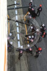 World © Octane Photographic Ltd. Formula 1 - Winter Test 2. Romain Grosjean - Haas F1 Team VF-17 and team doing a pit stop. Circuit de Barcelona-Catalunya. Friday 10th March 2017. Digital Ref: 1787LB5D0128