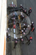 World © Octane Photographic Ltd. Formula 1 - Winter Test 2. Romain Grosjean - Haas F1 Team VF-17 and team doing a pit stop. Circuit de Barcelona-Catalunya. Friday 10th March 2017. Digital Ref: 1787LB5D0133