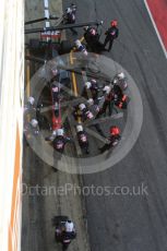 World © Octane Photographic Ltd. Formula 1 - Winter Test 2. Romain Grosjean - Haas F1 Team VF-17 and team doing a pit stop. Circuit de Barcelona-Catalunya. Friday 10th March 2017. Digital Ref: 1787LB5D0135