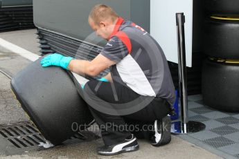 World © Octane Photographic Ltd. Formula 1 - Winter Test 1. Haas F1 Team crew member cleaning a set of wheels. Circuit de Barcelona-Catalunya. Tuesday 28th February2017. Digital Ref :1781CB1D3966