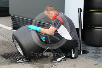 World © Octane Photographic Ltd. Formula 1 - Winter Test 1. Haas F1 Team crew member cleaning a set of wheels. Circuit de Barcelona-Catalunya. Tuesday 28th February2017. Digital Ref :1781CB1D3973