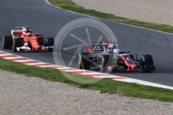 World © Octane Photographic Ltd. Formula 1 - Winter Test 1. Kimi Raikkonen - Scuderia Ferrari SF70H and Romain Grosjean - Haas F1 Team VF-17. Circuit de Barcelona-Catalunya. Thursday 2nd March 2017. Digital Ref :1783CB1D9640