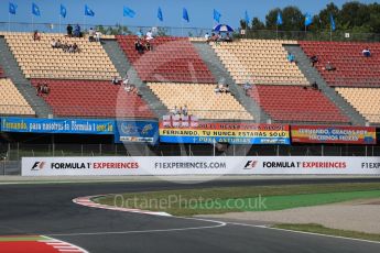 World © Octane Photographic Ltd. GP3 - Qualifying. Early morning grandstands with Alonso flags. Circuit de Barcelona - Catalunya, Spain. Saturday 13th May 2017. Digital Ref:1817LB1D0377
