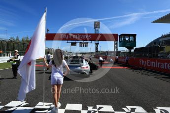 World © Octane Photographic Ltd. Formula 1 - Japanese Grand Prix - Sunday - Japanese Flag and Mercedes AMG GTs Safety Car on the grid. Suzuka Circuit, Suzuka, Japan. Sunday 8th October 2017. Digital Ref:1979LB2D5314