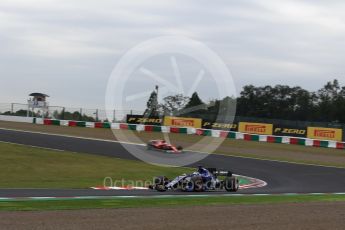 World © Octane Photographic Ltd. Formula 1 - Japanese Grand Prix - Friday - Practice 1. Marcus Ericsson – Sauber F1 Team C36 and Sebastian Vettel - Scuderia Ferrari SF70H. Suzuka Circuit, Suzuka, Japan. Friday 6th October 2017. Digital Ref:1972LB2D3211