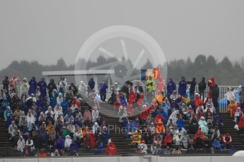 World © Octane Photographic Ltd. Formula 1 - Japanese Grand Prix - Friday - Practice 2. Grandstand crowds wrapped up in the rain. Suzuka Circuit, Suzuka, Japan. Friday 6th October 2017. Digital Ref:1973LB1D8152