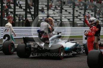 World © Octane Photographic Ltd. Formula 1 - Japanese Grand Prix - Saturday - Qualifying. Lewis Hamilton and Valtteri Bottas - Mercedes AMG Petronas F1 W08 EQ Energy+ and Sebastian Vettel - Scuderia Ferrari SF70H on track to be interviewed. Suzuka Circuit, Suzuka, Japan. Saturday 7th October 2017. Digital Ref:1977LB2D5083