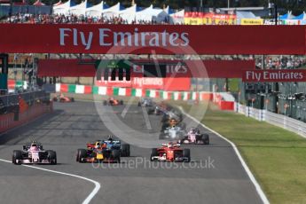 World © Octane Photographic Ltd. Formula 1 - Japanese Grand Prix - Sunday - Race. Lap2, Esteban Ocon - Sahara Force India VJM10, Daniel Ricciardo - Red Bull Racing RB13, Valtteri Bottas - Mercedes AMG Petronas F1 W08 EQ Energy+ and Sebastian Vettel - Scuderia Ferrari SF70H all contest the corner. Suzuka Circuit, Suzuka, Japan. Sunday 8th October 2017. Digital Ref:1980LB1D0519
