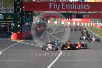 World © Octane Photographic Ltd. Formula 1 - Japanese Grand Prix - Sunday - Race. Lap2, Esteban Ocon - Sahara Force India VJM10, Daniel Ricciardo - Red Bull Racing RB13, Valtteri Bottas - Mercedes AMG Petronas F1 W08 EQ Energy+ and Sebastian Vettel - Scuderia Ferrari SF70H all contest the corner. Suzuka Circuit, Suzuka, Japan. Sunday 8th October 2017. Digital Ref:1980LB1D0523
