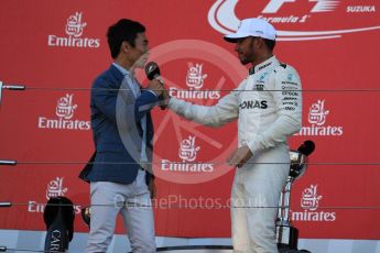 World © Octane Photographic Ltd. Formula 1 - Japanese Grand Prix - Sunday - Podium. Lewis Hamilton - Mercedes AMG Petronas F1 W08 EQ Energy+and Takuma Sato. Suzuka Circuit, Suzuka, Japan. Sunday 8th October 2017. Digital Ref:1981LB1D1685