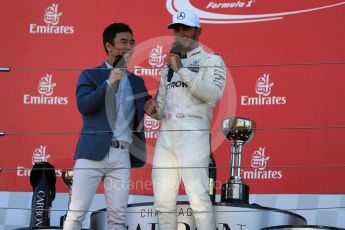 World © Octane Photographic Ltd. Formula 1 - Japanese Grand Prix - Sunday - Podium. Lewis Hamilton - Mercedes AMG Petronas F1 W08 EQ Energy+and Takuma Sato. Suzuka Circuit, Suzuka, Japan. Sunday 8th October 2017. Digital Ref:1981LB1D1700